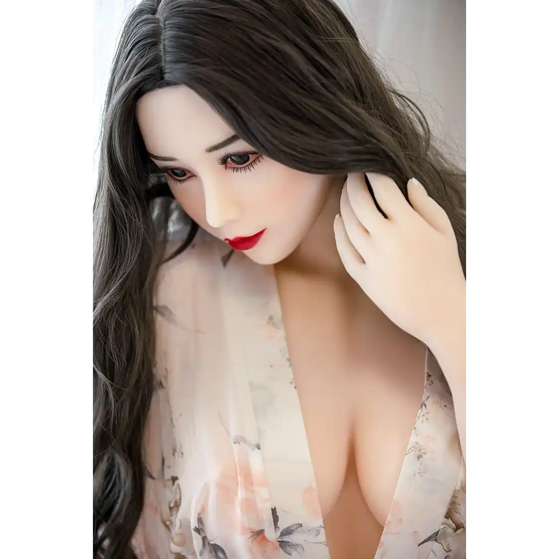 5ft 3in 159cm curvy Asian TPE sex doll with long wavy black hair, fair sking and large E-cup breasts in see through lingerie.