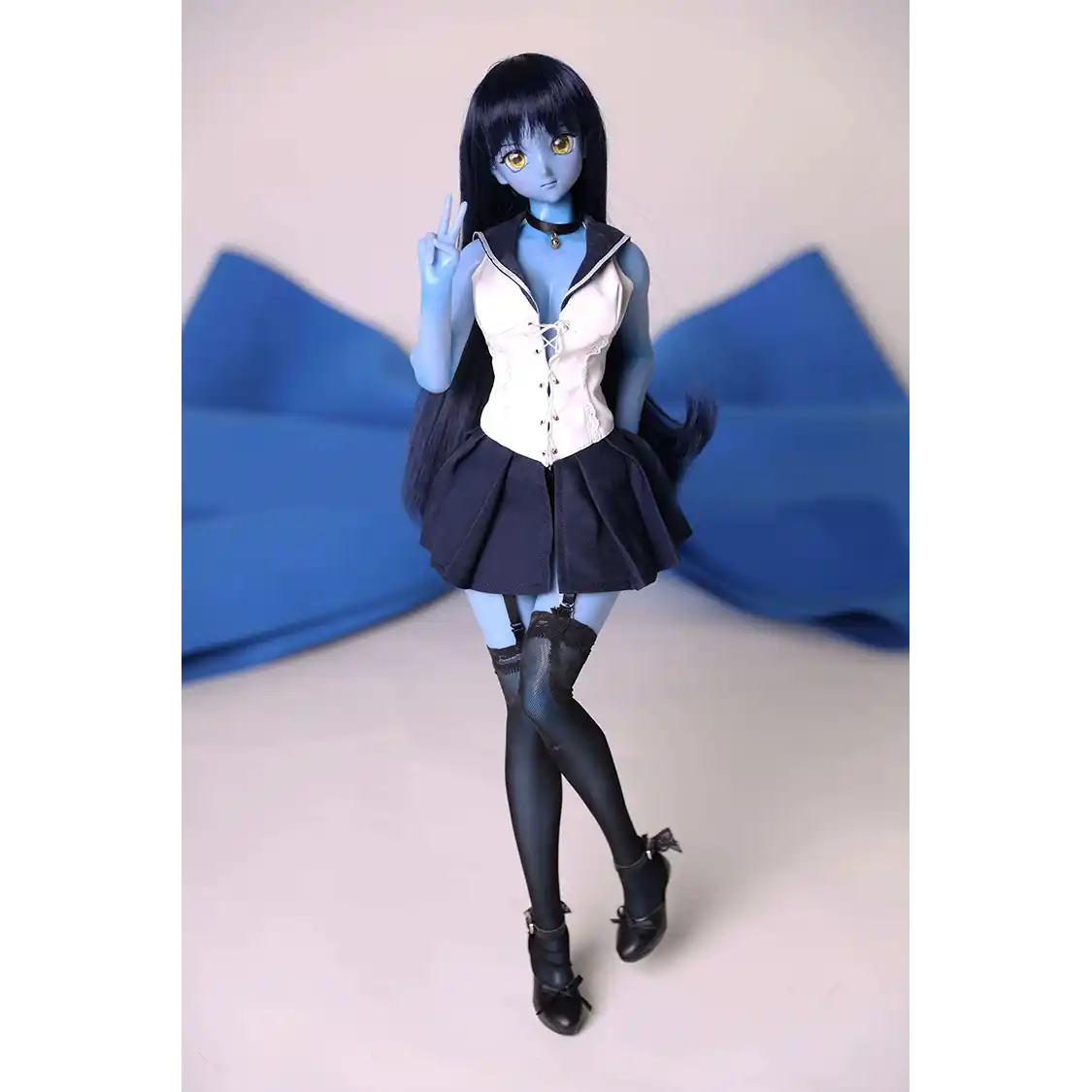 2ft 60cm anime style female mini silicone sex doll with medium breasts, blue skin and a fit athletic body in a sailor moon outfit.