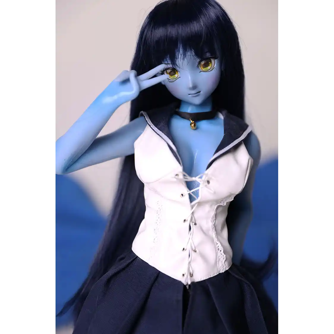 2ft 60cm anime style female mini silicone sex doll with medium breasts, blue skin and a fit athletic body in a sailor moon outfit.