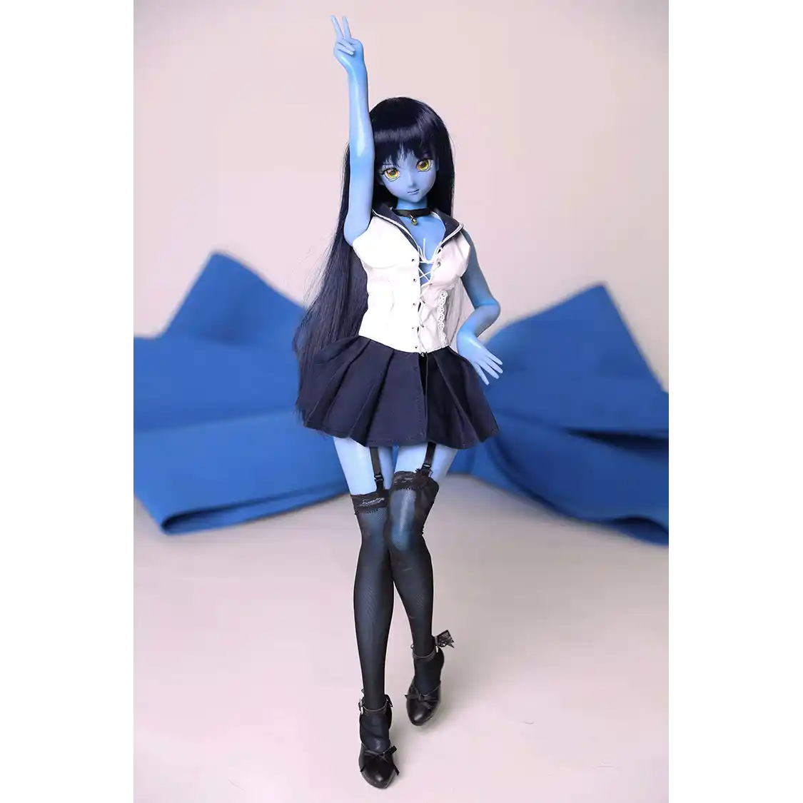 2ft 60cm anime style female mini silicone sex doll with medium breasts, blue skin and a fit athletic body in a sailor moon outfit.