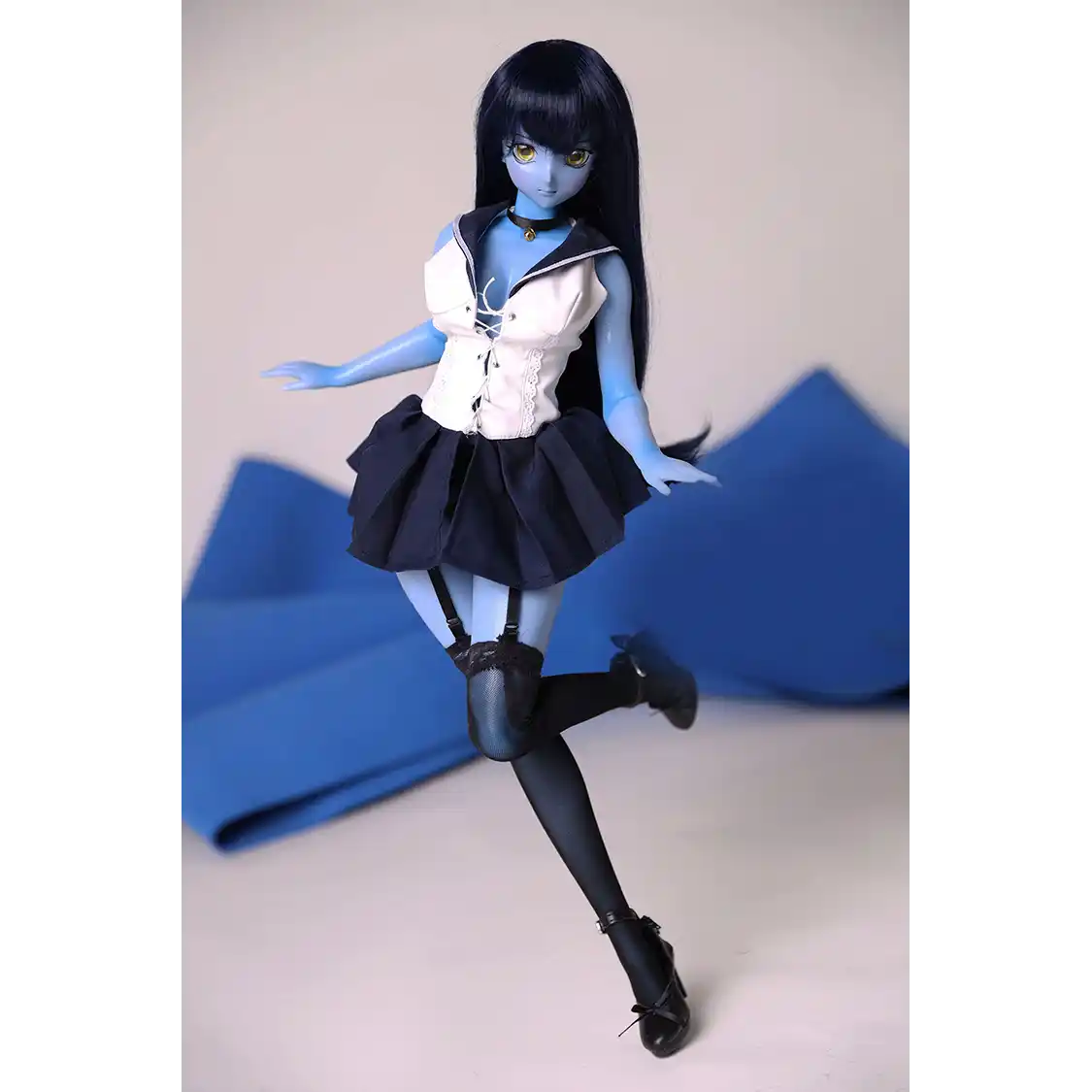 2ft 60cm anime style female mini silicone sex doll with medium breasts, blue skin and a fit athletic body in a sailor moon outfit.