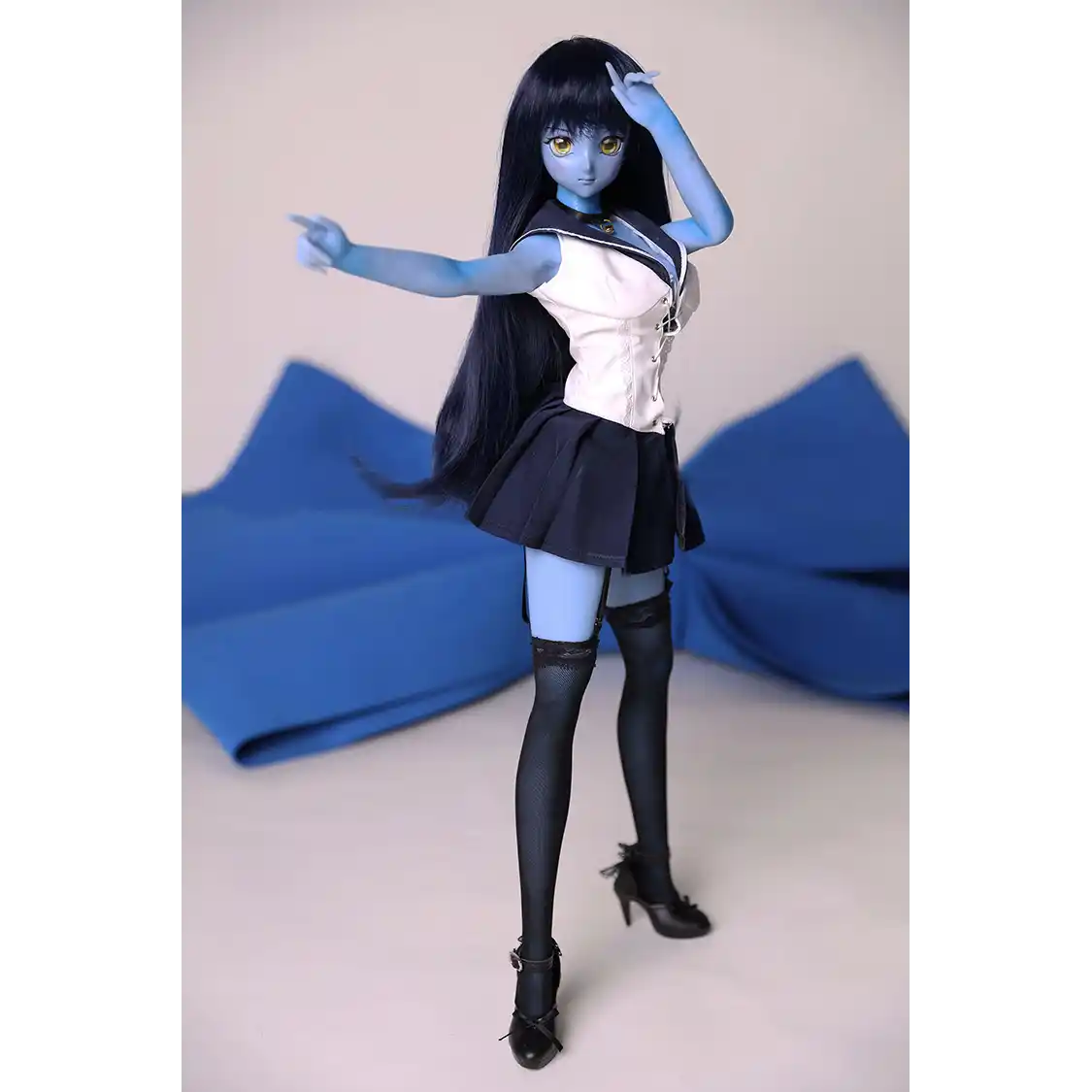 2ft 60cm anime style female mini silicone sex doll with medium breasts, blue skin and a fit athletic body in a sailor moon outfit.