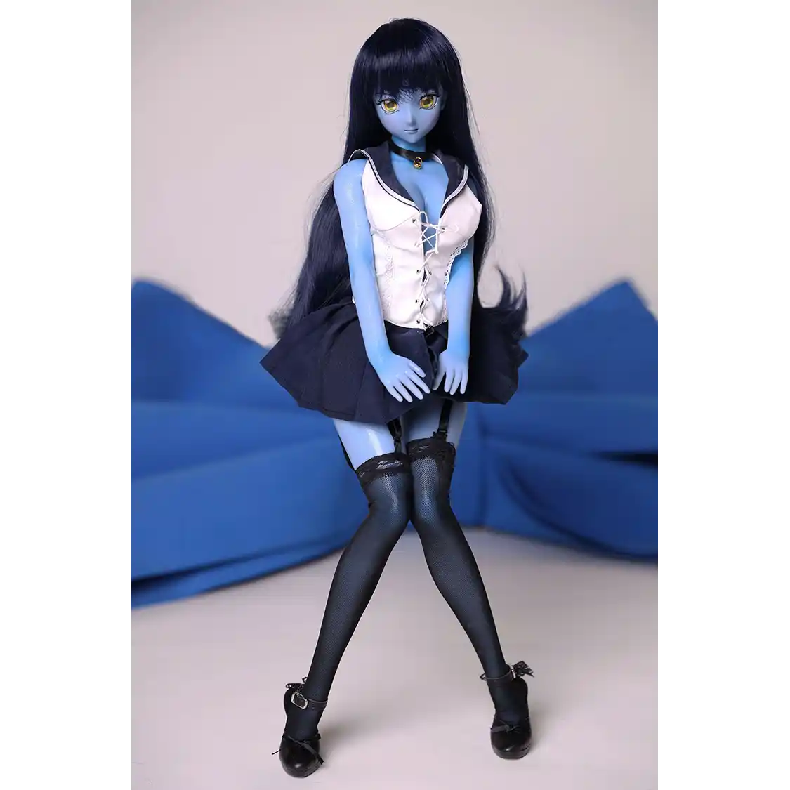2ft 60cm anime style female mini silicone sex doll with medium breasts, blue skin and a fit athletic body in a sailor moon outfit.