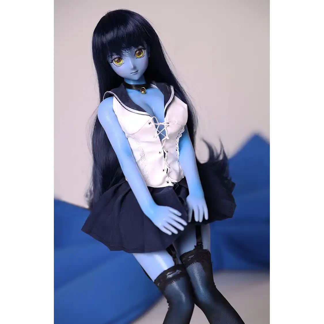 2ft 60cm anime style female mini silicone sex doll with medium breasts, blue skin and a fit athletic body in a sailor moon outfit.