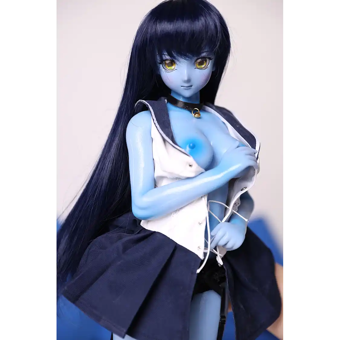 2ft 60cm anime style female mini silicone sex doll with medium breasts, blue skin and a fit athletic body in a sailor moon outfit.