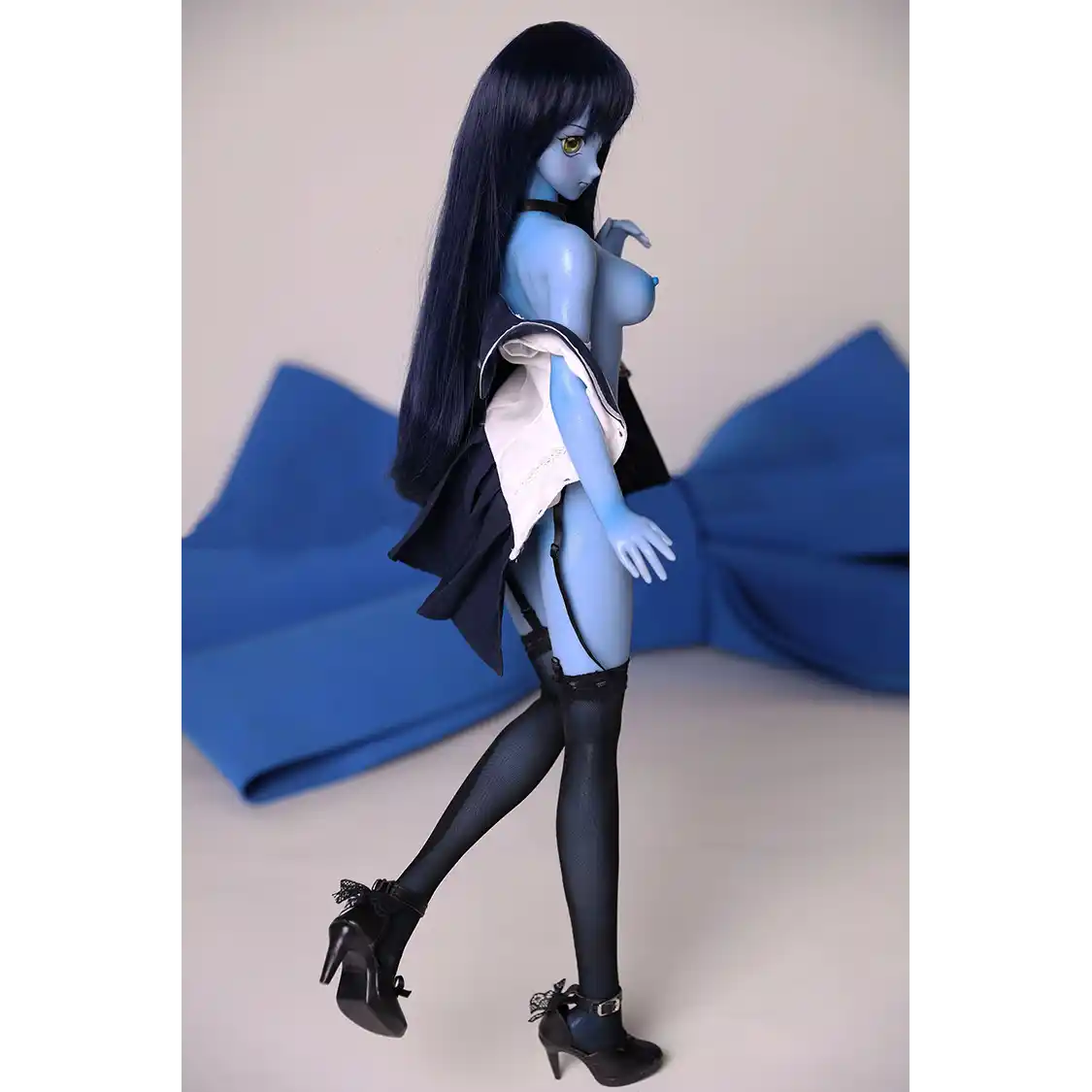 2ft 60cm anime style female mini silicone sex doll with medium breasts, blue skin and a fit athletic body in a sailor moon outfit.