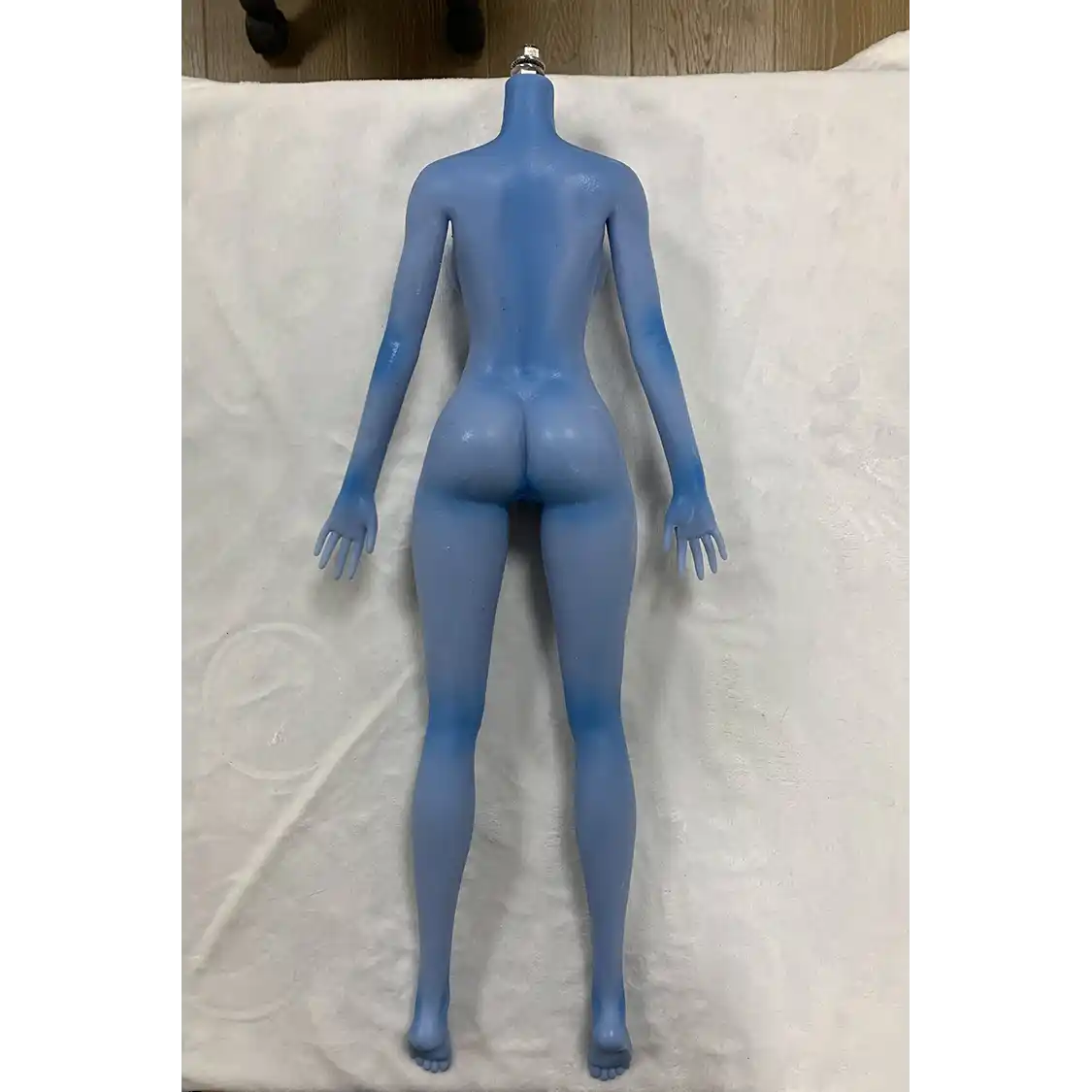 2ft 60cm anime style female mini silicone sex doll with medium breasts, blue skin and a fit athletic body in a sailor moon outfit.