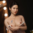 Yuki, 5ft 5in or 165cm life size ultra realistic female Asian silicone sex doll with long dark hair, brown eyes and C-cup breasts with light skin.  Made by Zing Dolls.