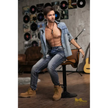 5ft 6in or 170cm silicone male sex doll with muscular arms, chest and abs with short brown hair and blue eyes in a country outfit.