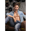 5ft 6in or 170cm silicone male sex doll with muscular arms, chest and abs with short brown hair and blue eyes in a country outfit.