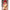 3ft 1in or 95cm tall Aoi.  Mini Anime silicone sex doll with large breasts, long red hair, heart eyes and a tiger striped bikini. Made by Irokebijin.