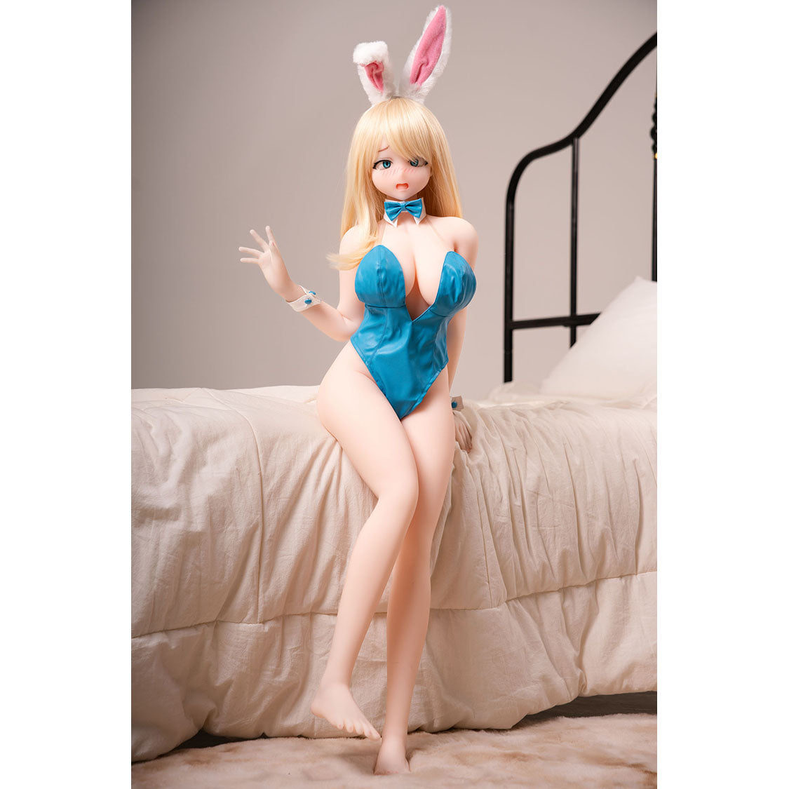 3ft 1in or 95cm tall Yui B.  Mini Anime TPE sex doll with large breasts, long blonde hair,  blue eyes and a blue body suit. Made by Irokebijin.