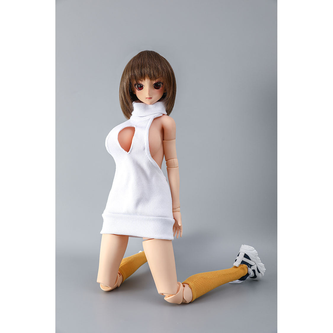 2ft 62cm mini anime sex doll Vanya. Silicone body construction, large breasts, fair skin, short brown hair and a slim athletic body with hard plastic limbs in a sexy white blouse.