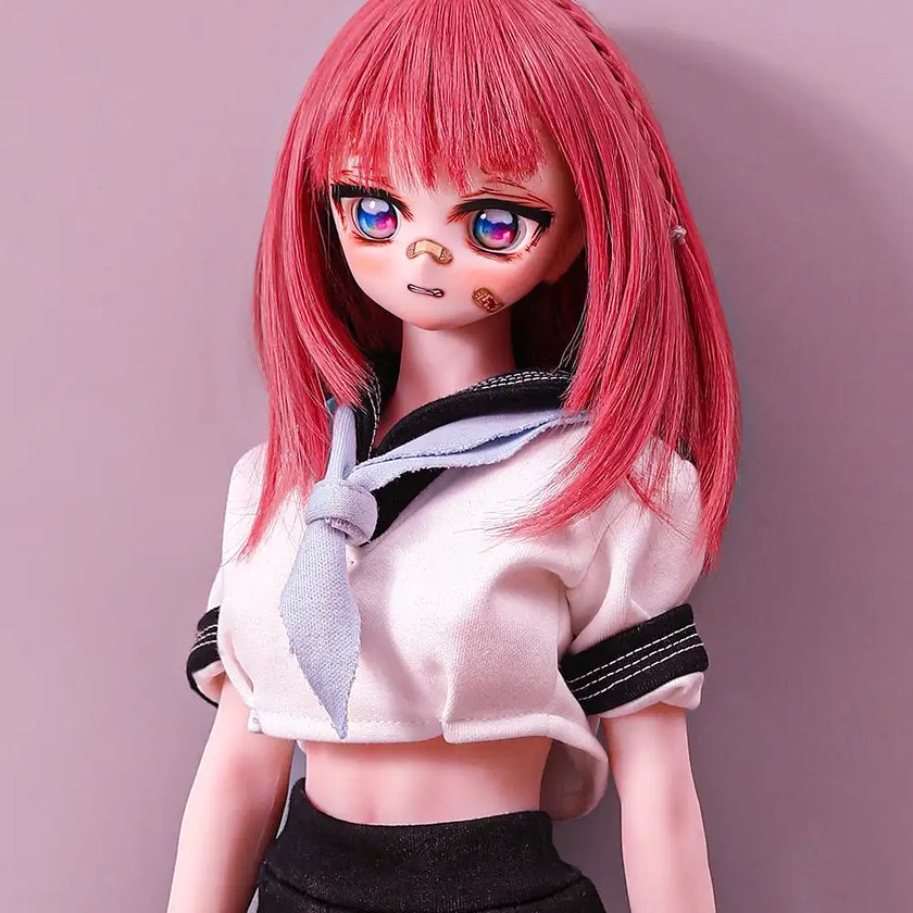 2ft 60cm anime style female mini silicone sex doll with medium breasts, fair skin and a fit athletic body in a school girl outfit.