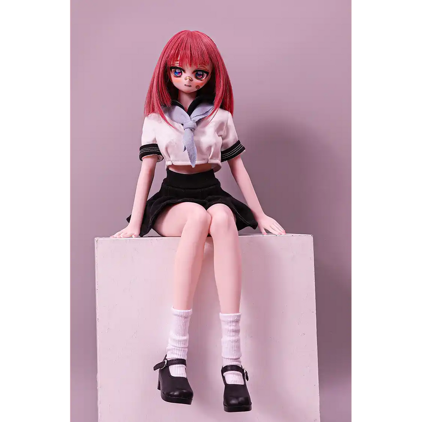 2ft 60cm anime style female mini silicone sex doll with medium breasts, fair skin and a fit athletic body in a school girl outfit.