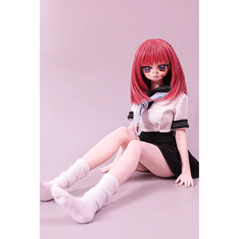 2ft 60cm anime style female mini silicone sex doll with medium breasts, fair skin and a fit athletic body in a school girl outfit.