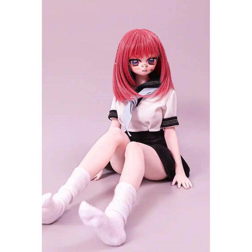 2ft 60cm anime style female mini silicone sex doll with medium breasts, fair skin and a fit athletic body in a school girl outfit.
