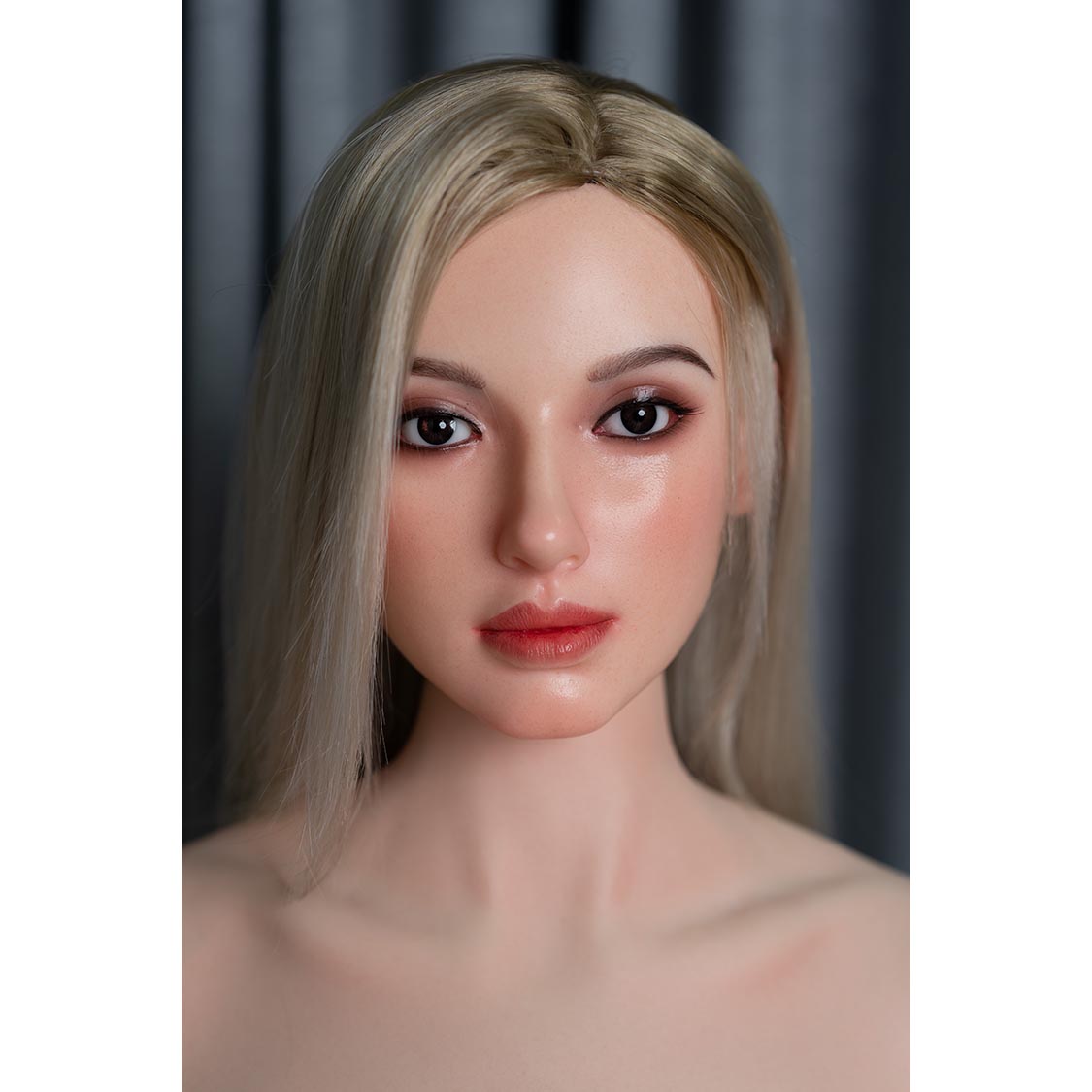 5ft 9in 175cm life size skinny female real silicone sex doll with long blonde hair and C-cup breasts with very light skin.  Made by Zelex.