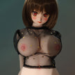 2ft 60cm mini anime sex doll Zella. Silicone body construction, giant breasts, fair skin, short dark hair and a curvy body in a  sheer top, black leather jacket and black skirt.