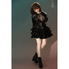 2ft 60cm mini anime sex doll Zella. Silicone body construction, giant breasts, fair skin, short dark hair and a curvy body in a  sheer top, black leather jacket and black skirt.