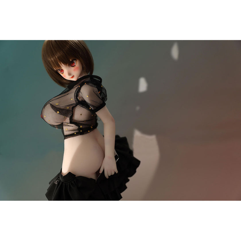2ft 60cm mini anime sex doll Zella. Silicone body construction, giant breasts, fair skin, short dark hair and a curvy body in a  sheer top, black leather jacket and black skirt.
