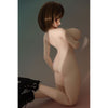 2ft 60cm mini anime sex doll Zella. Silicone body construction, giant breasts, fair skin, short dark hair and a curvy body in a  sheer top, black leather jacket and black skirt.