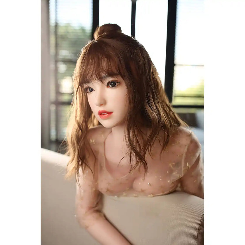 Gorgeous full size lifelike 5ft 5in or 165cm Asian female silicone sex doll with long brown hair, medium sized silicone gel filled breasts and light skin.  Made by Future Doll.