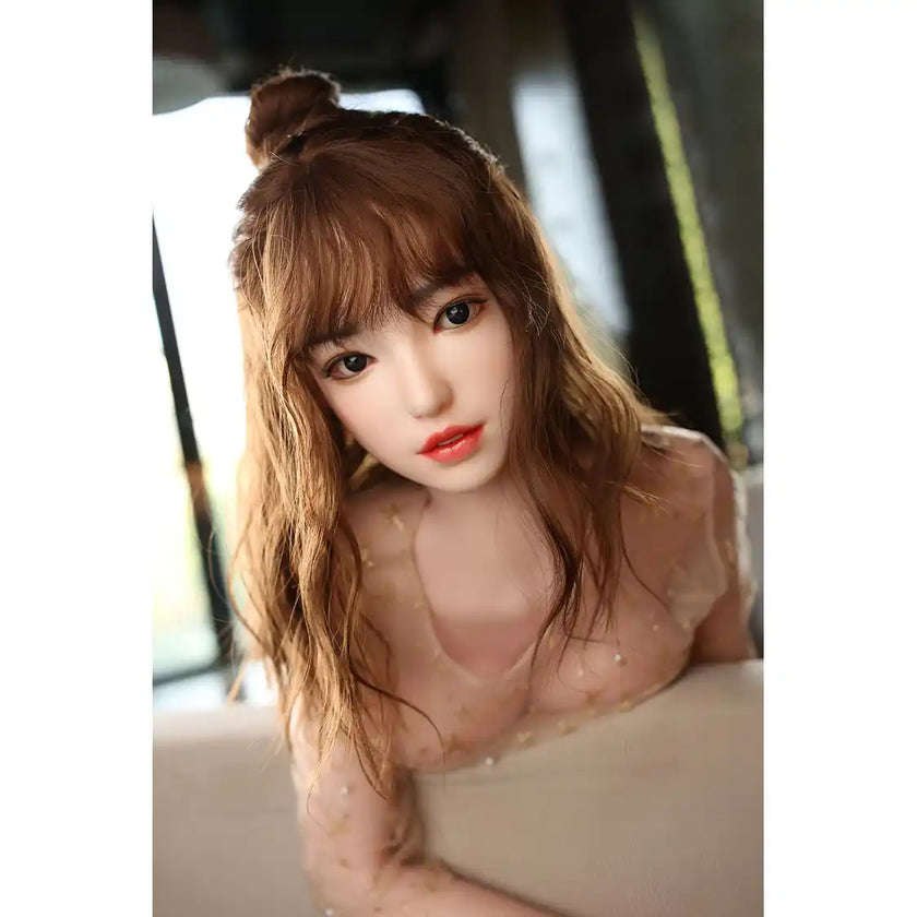 Gorgeous full size lifelike 5ft 5in or 165cm Asian female silicone sex doll with long brown hair, medium sized silicone gel filled breasts and light skin.  Made by Future Doll.