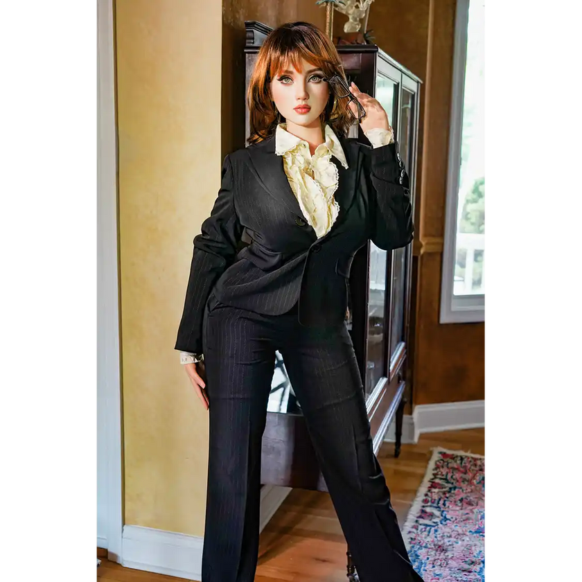 5ft 4in or 163cm tall life size hyper realistic silicone sex doll with long legs, very large breasts and medium length red hair with hazel eyes. Made by Normon Doll.