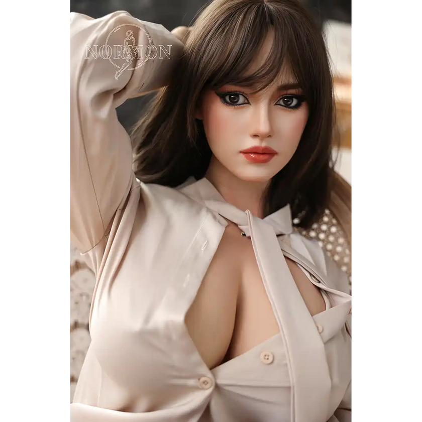 5ft 4in or 163cm tall life size hyper realistic silicone sex doll with long legs, very large breasts and medium length brown hair with brown eyes. Made by Normon Doll.